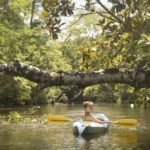 Teenage boy in kayak, Econfina Creek, Youngstown, Florida, USA